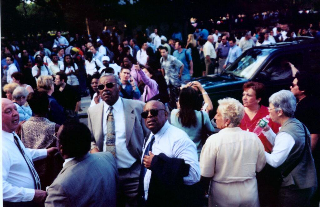 Crowd of people gathered on a New York City street on September 11, 2001
