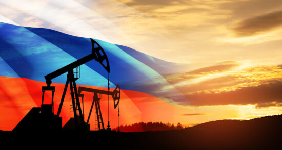 Oil drilling derricks at desert oilfield. The change in oil prices caused by the war. Oil prices are rising.