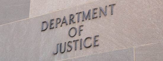 Sign at the United States Department of Justice DOJ in Washington, DC-Shutterstock_2262073553
