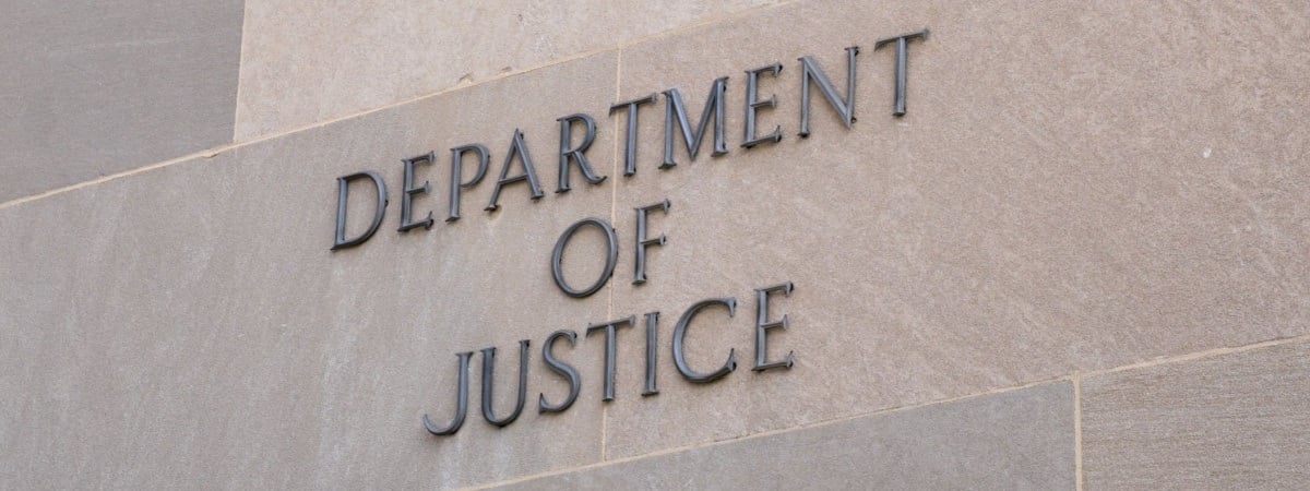 Sign at the United States Department of Justice DOJ in Washington, DC-Shutterstock_2262073553